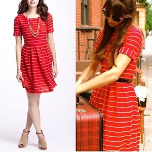 Red Anthropologie dress with tan scallops